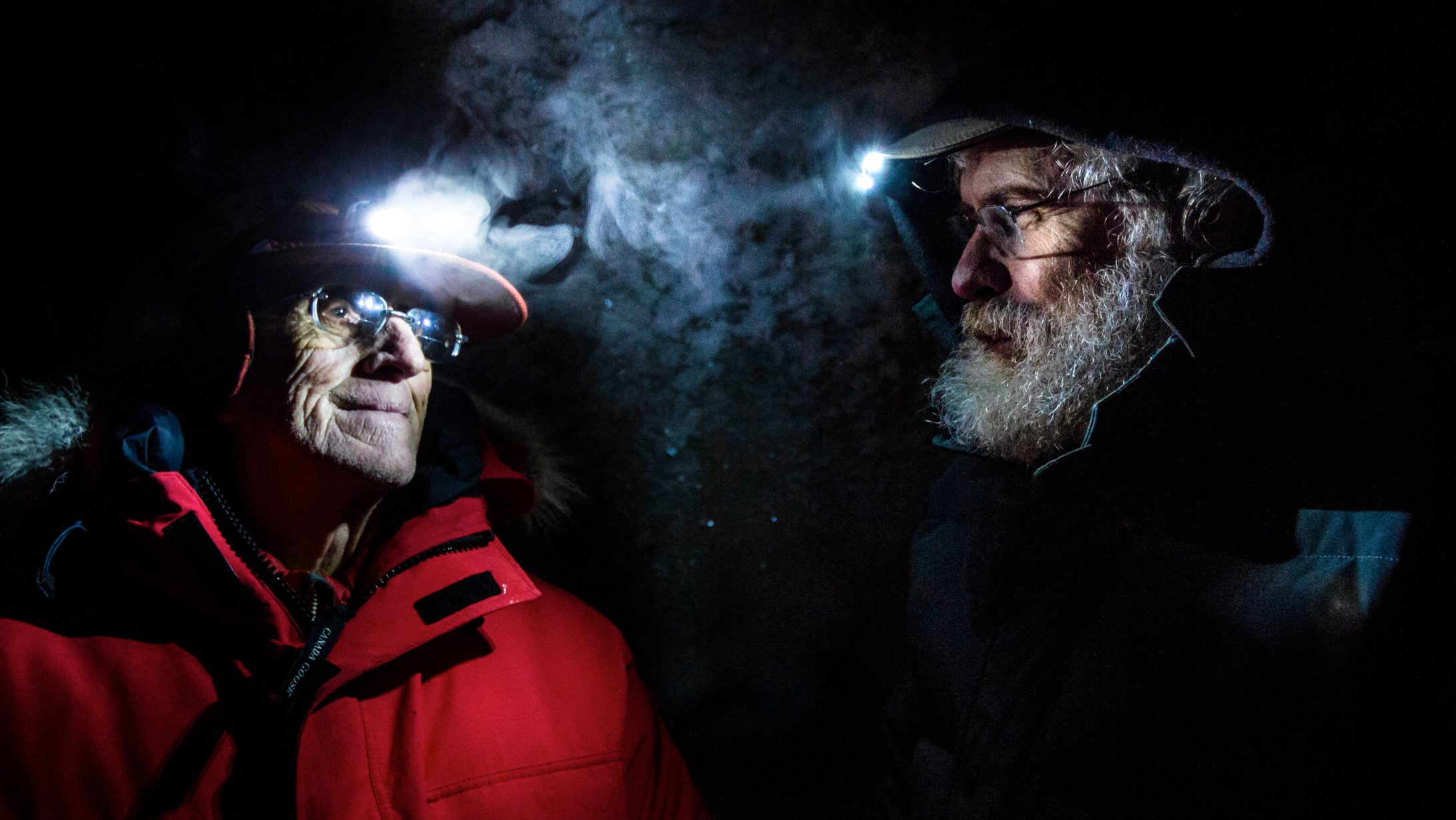 Stewart Brand and George Church explore an ice tunnel in Siberia’s permafrost.